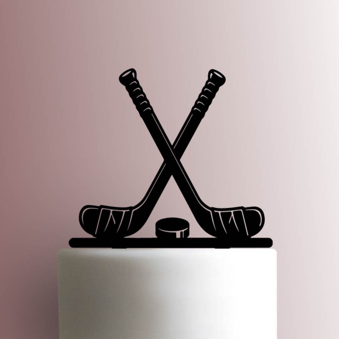 https://www.jbcookiecutters.com/wp-content/uploads/2022/01/JB_Hockey-Sticks-with-Puck-225-A747-Cake-Topper.jpg